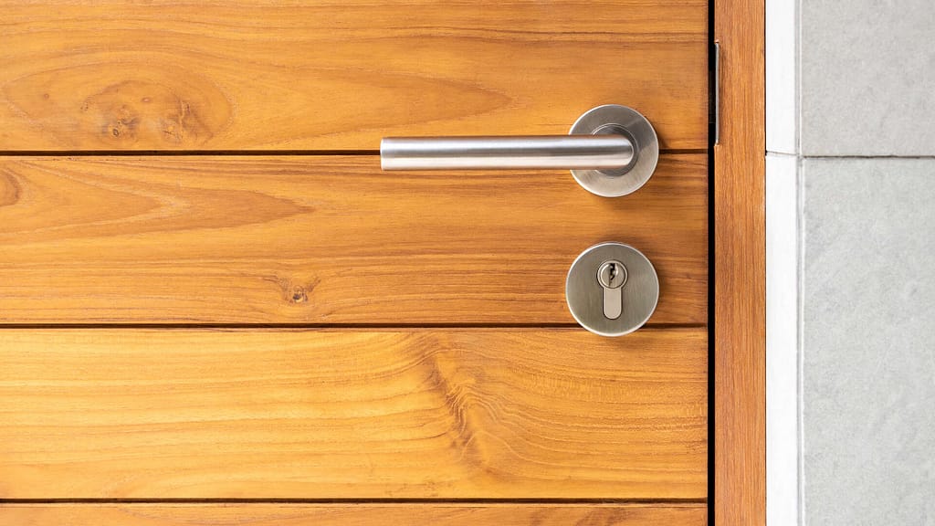 wooden door with stainless lock and handle