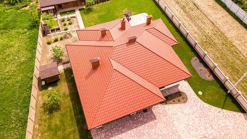 Aerial view of a big residential house with orange roof