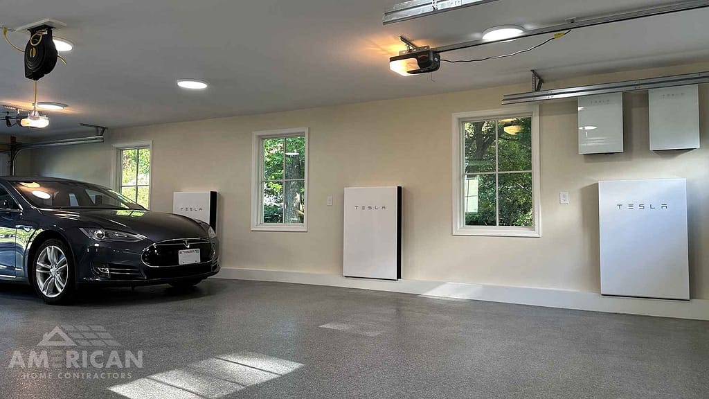 Tesla Powerwalls in a garage with tesla vehicle