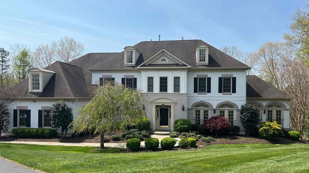 big house and yard with beautiful rood installed by Virginia roofing contractor and roofer