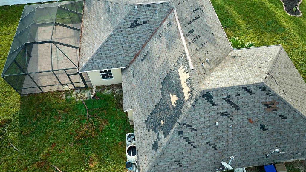 big house with damaged roof