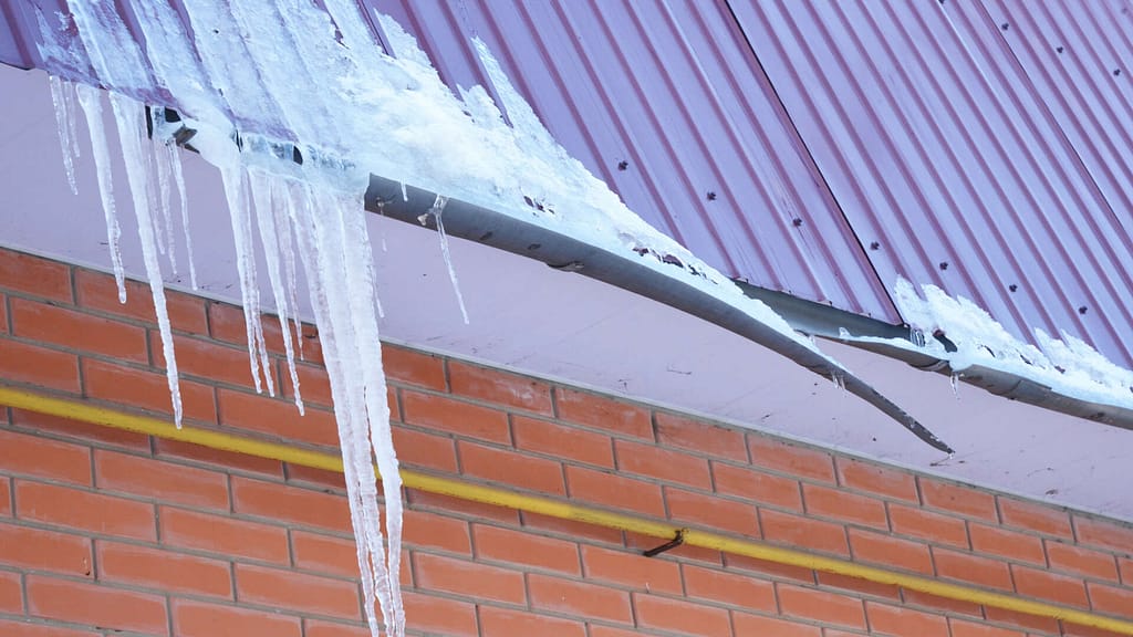 damaged roof gutter due to ice dam