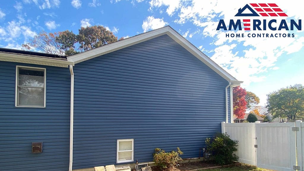 house with blue vinyl siding installed by american home contractors
