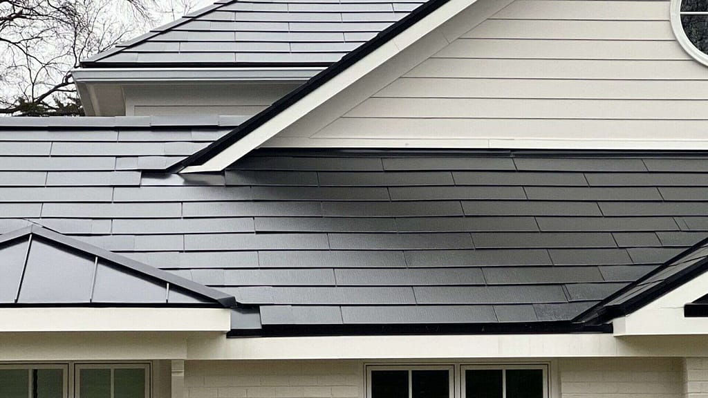 House with Tesla solar roof installed by American Home Contractors