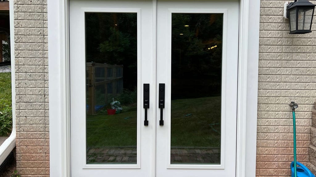 White entry door installed by American Home Contractors