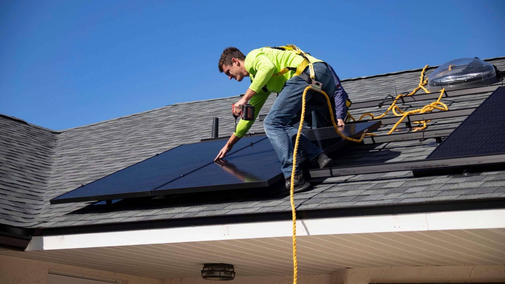 American Home Contractors installing solar panels on a rooftop