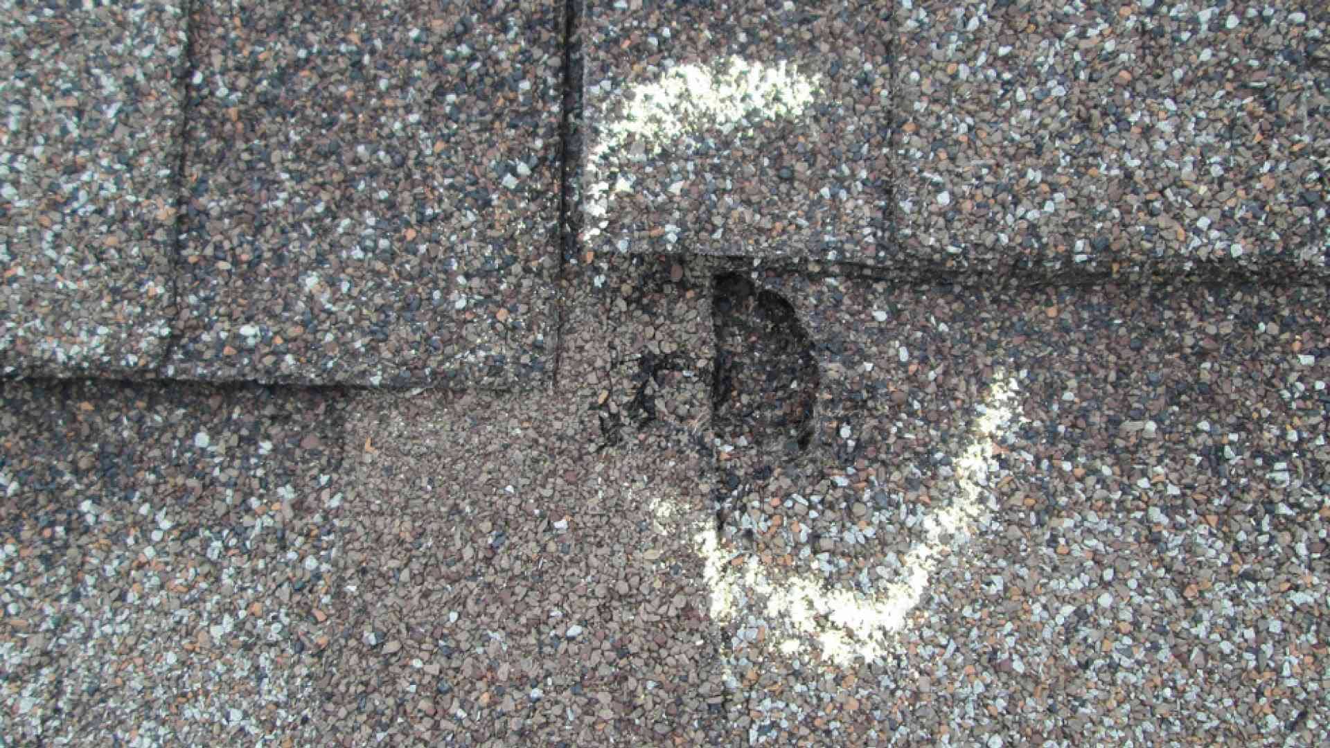 Damage on a roof being marked for repair