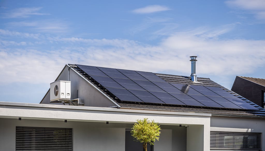 Roof of modern house with solar panels installed.