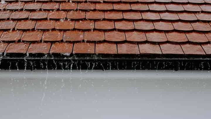water rushing down a roof