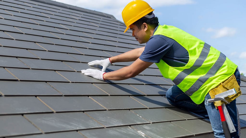 roofer doing roof maintenance