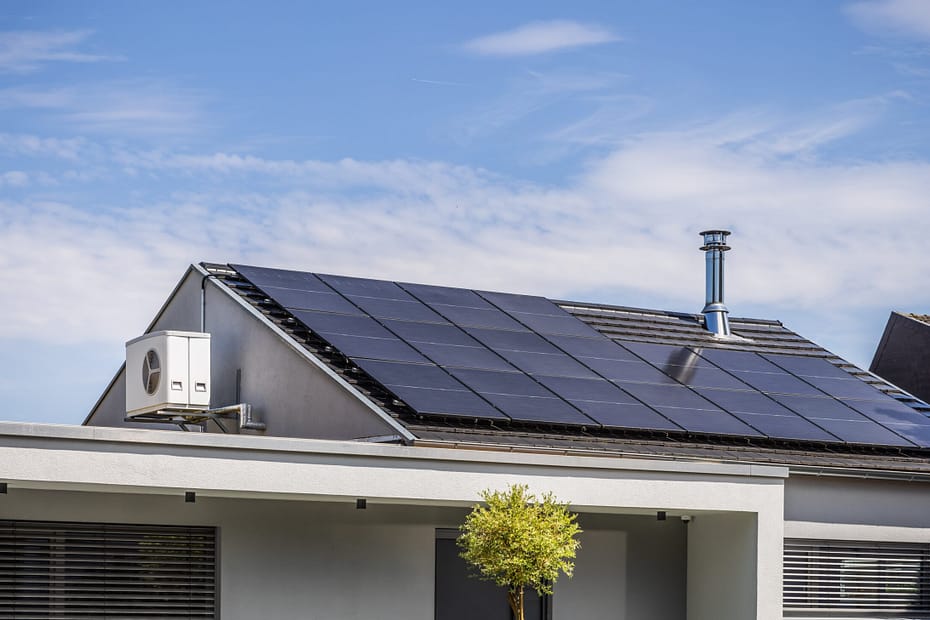 Roof of modern house with solar panels installed.